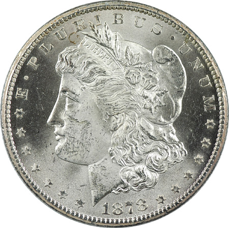 Two Morgan Silver Dollars.