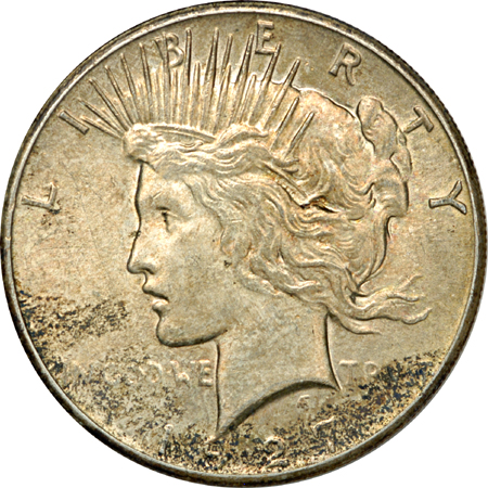 1927, 1928, and 1935 Peace dollars.