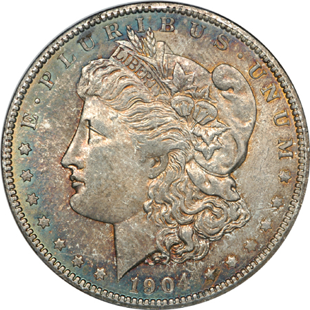 1885-O and 1904-O Morgan dollars, NGC.