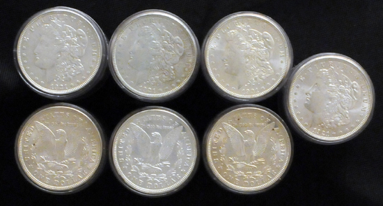 Seven AU/BU 1921 (tubes) rolls of Morgan dollars.