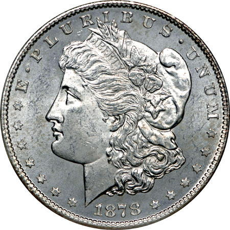 Seven certified Morgan silver dollars.