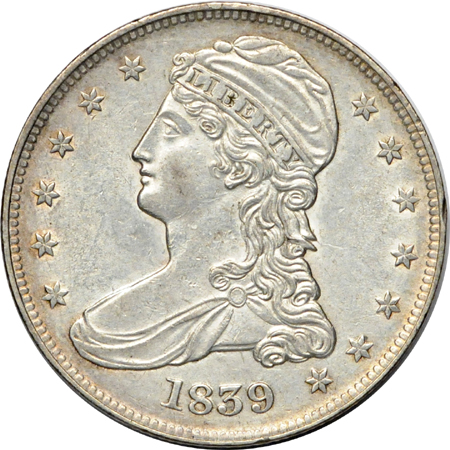 Seven half-dollar type coins.