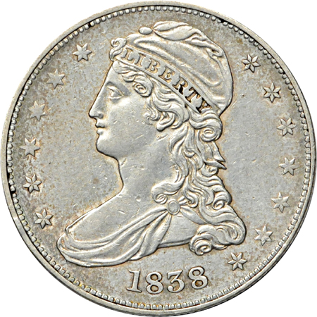 Four half-dollar type coins.