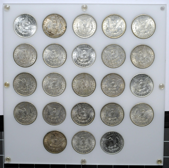 Capital Plastics board (1898 - 1921) of Morgan dollars.