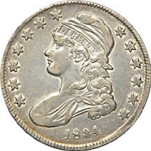 Four half-dollar type coins.