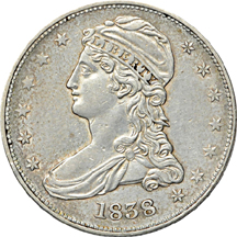 Four half-dollar type coins.