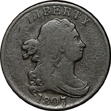Three half-cent type coins.