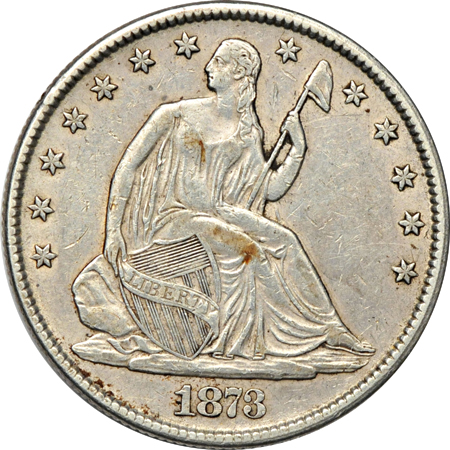 Three 1873 Liberty Seated half-dollars.