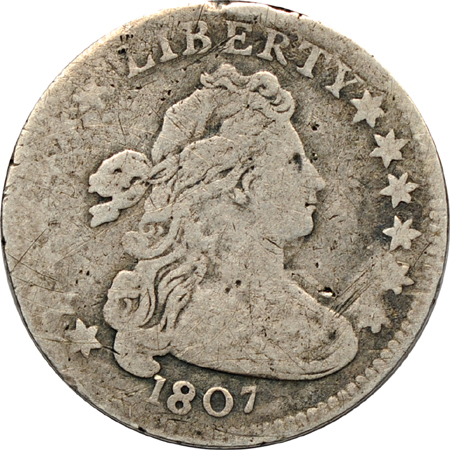 Three 1807 silver type coins.