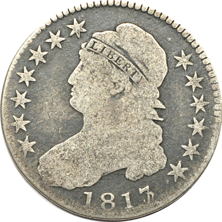 Four Capped Bust half-dollars.