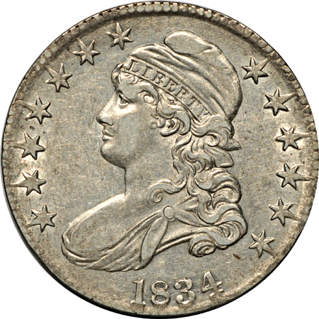 Pair of 1834 Capped Bust half-dollars.