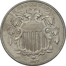 Four nickel type coins.