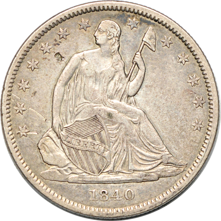 Seventeen Seated Liberty half-dollars.