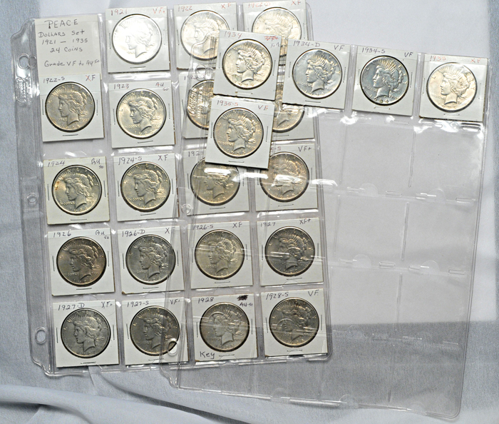 Three complete Peace dollar sets in sheets.