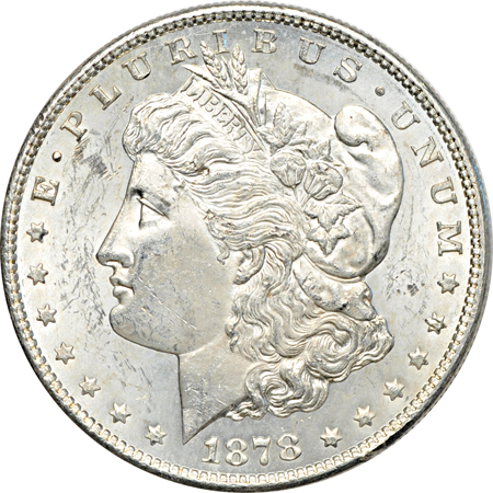 Twenty collector date/grade Morgan dollars.