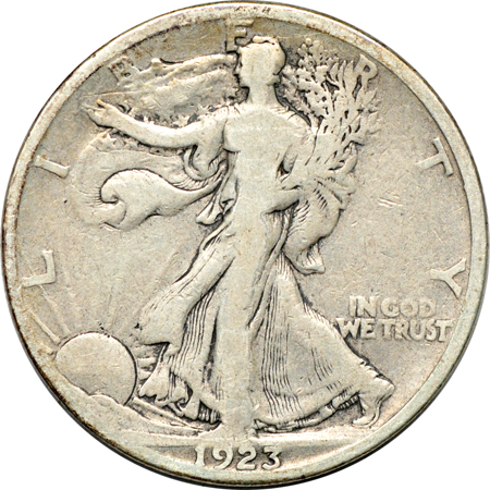 Twenty-one collector date/grade Walking Liberty half-dollars.