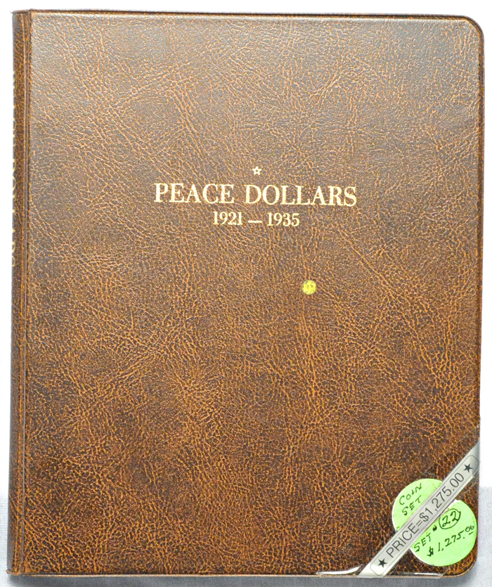 Complete set of Peace dollars in a Harco folder.