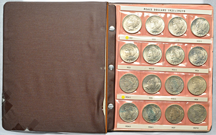 Complete set of Peace dollars in a Harco folder.