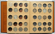 Thirty-six circulated Seated half-dollars in a Dansco-like album.