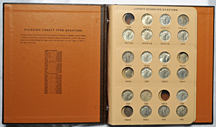 Nearly complete set of Standing Liberty quarters in a Dansco 7132 album.