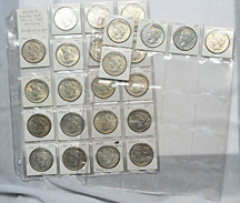 Three complete Peace dollar sets in sheets.