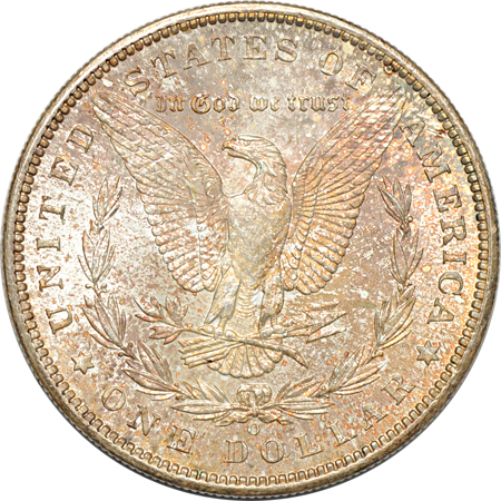 Four richly toned Morgan dollars.