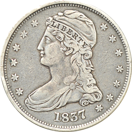 Twenty type coins 1/2 cent through 1/2 dollar, including two Silver Commemoratives and a love token.