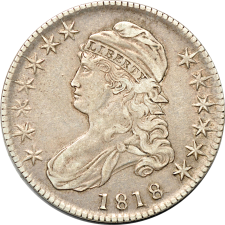 Four Capped Bust half-dollars.