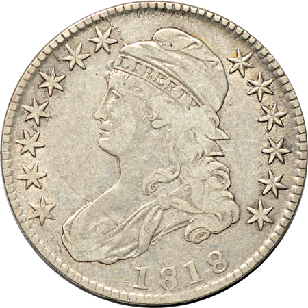 Four Capped Bust half-dollars.