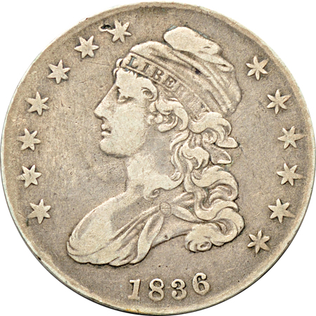 Five Capped Bust half-dollars.