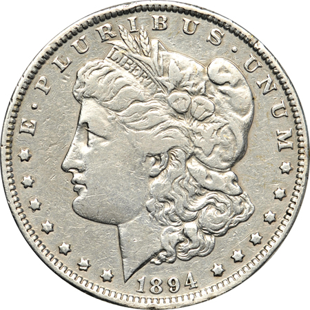 Nine collector date Morgan dollars.