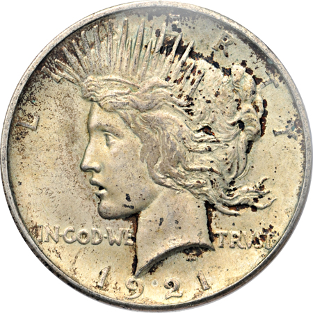 1921 PCGS MS-63 and three other certified Peace dollars.