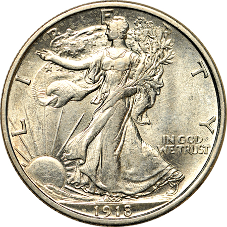 Four collector date Walking Liberty half-dollars.