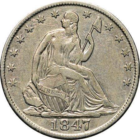 Twenty Seated Liberty half-dollars.