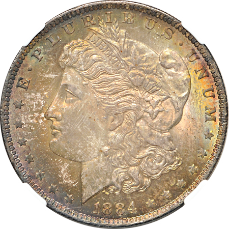 1884-O NGC MS-64 toned, and 1884-O NGC UNC details/environmental damage/toned.