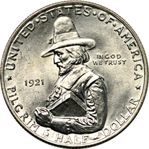 Four uncirculated silver commemorative half-dollars.