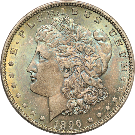 Two Morgan and two Peace silver dollars.