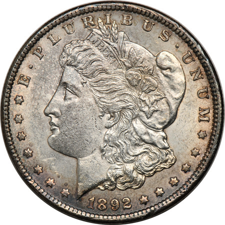 1876-S Trade dollar AU details/cleaned, and an 1892-CC Morgan dollar AU details.