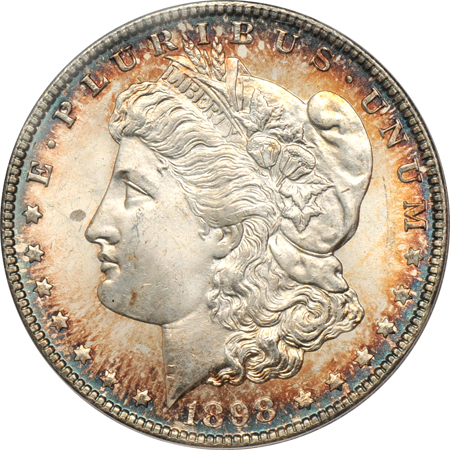 Four toned Morgan dollars, all PCGS MS-65.