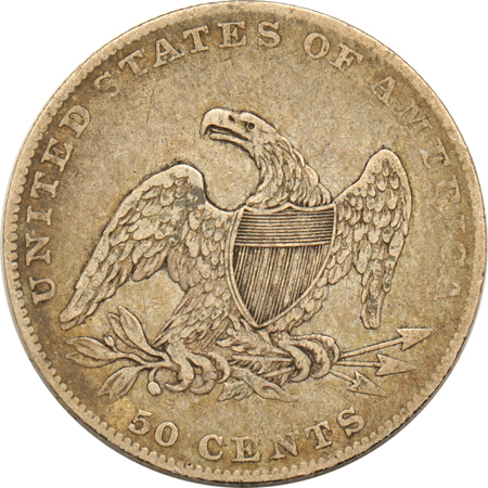 Five half-dollar type coins, as described.