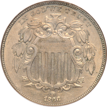 Five nickel type coins.