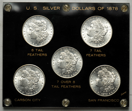 Five 1878 dated silver dollars in a Capital Plastics case.