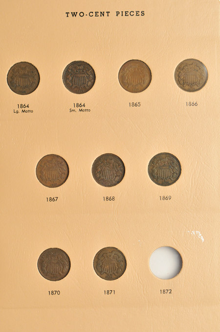 Partial collection of two-cent and three-cent pieces in a Dansco 6108 album.