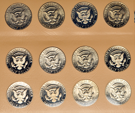 Collection of Franklin and Kennedy half-dollars in Dansco albums, as described.