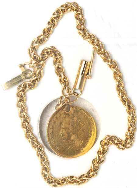 1857-C gold dollar on a gold chain.