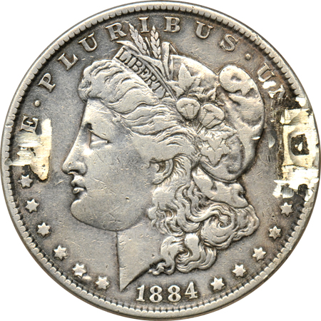 Ornate Pin made from an 1884 Morgan dollar.