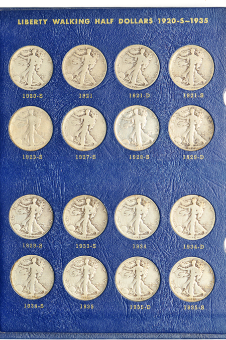 Complete collections of Walking Liberty and Franklin half-dollars in three Whitman albums.