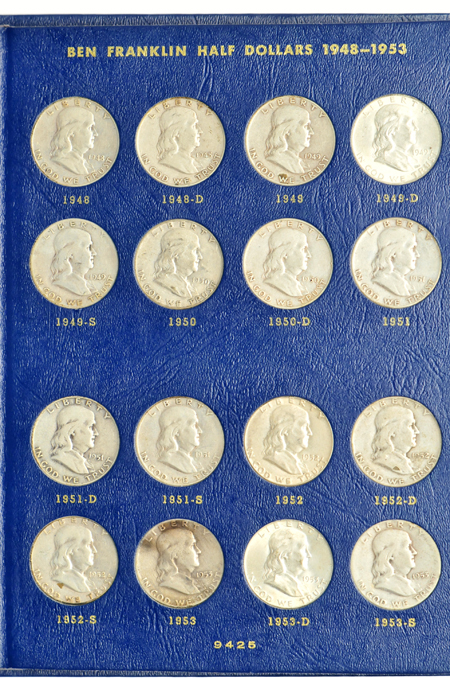 Complete collections of Walking Liberty and Franklin half-dollars in three Whitman albums.