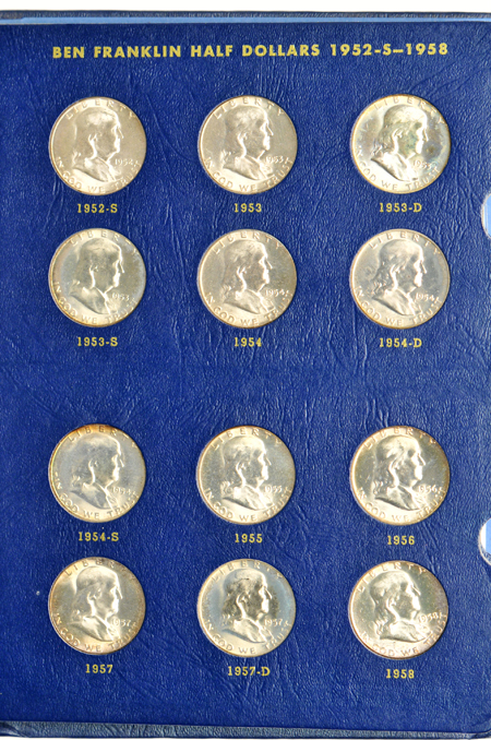 Collections of Washington quarters and Franklin half-dollars in Whitman albums.