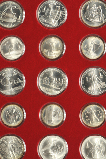 Russia - Collection of Olympics coins in a red binder.